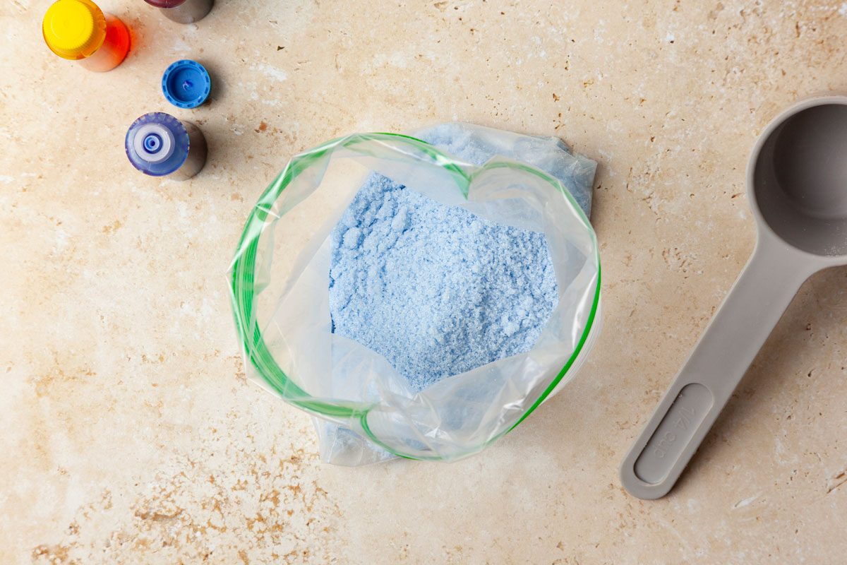 Step 1 of Taste of Home Colored Sugar is to combine the sugar and a few drops of food coloring in a small resealable plastic bag. Seal the bag and shake it to tint the sugar.