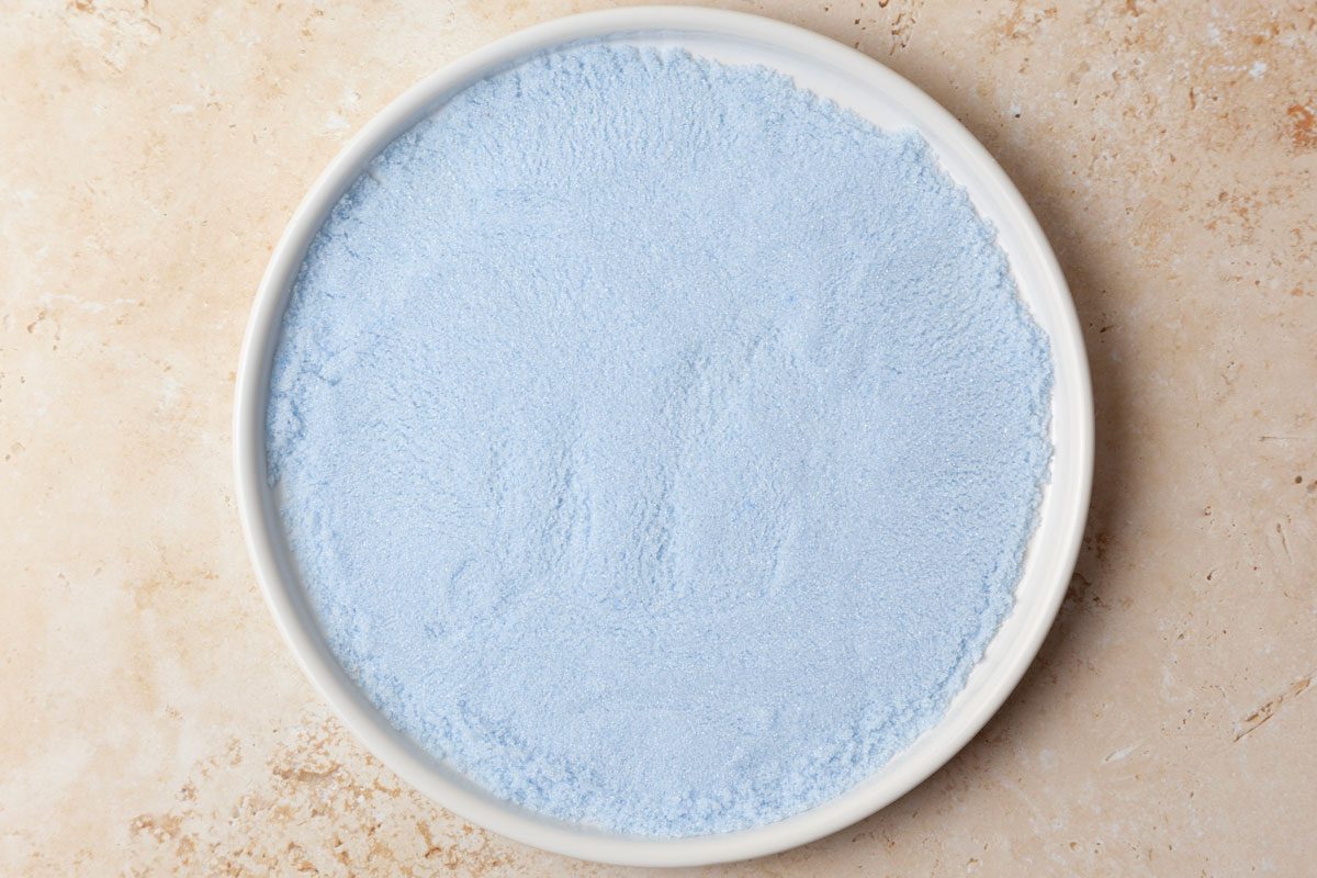 Step 2 of Taste of Home Colored Sugar is to spread the sugar out onto a flat surface, and allow it to dry for 15 to 20 minutes before using.