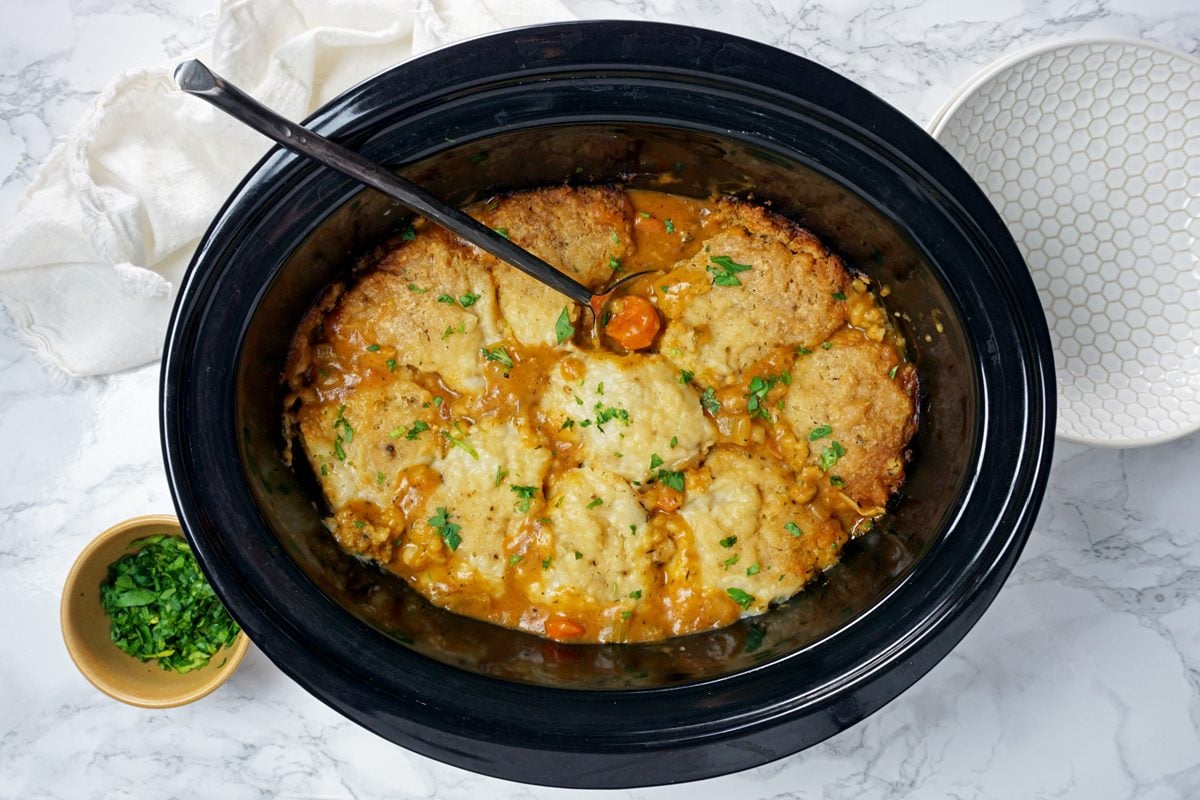 A slow cooker with golden Crock-Pot Chicken and Dumplings RMS 201122 for Taste of Home