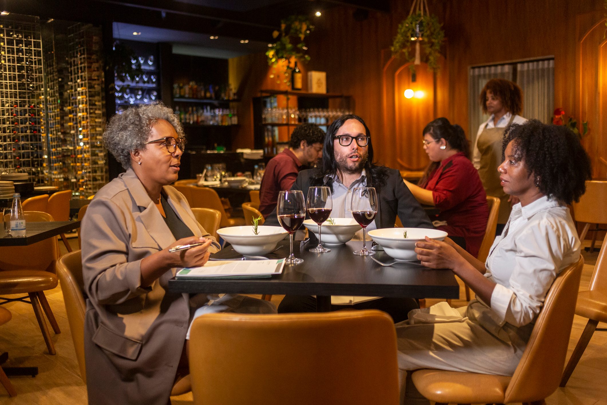 Executives at a business dinner in a sophisticated restaurant