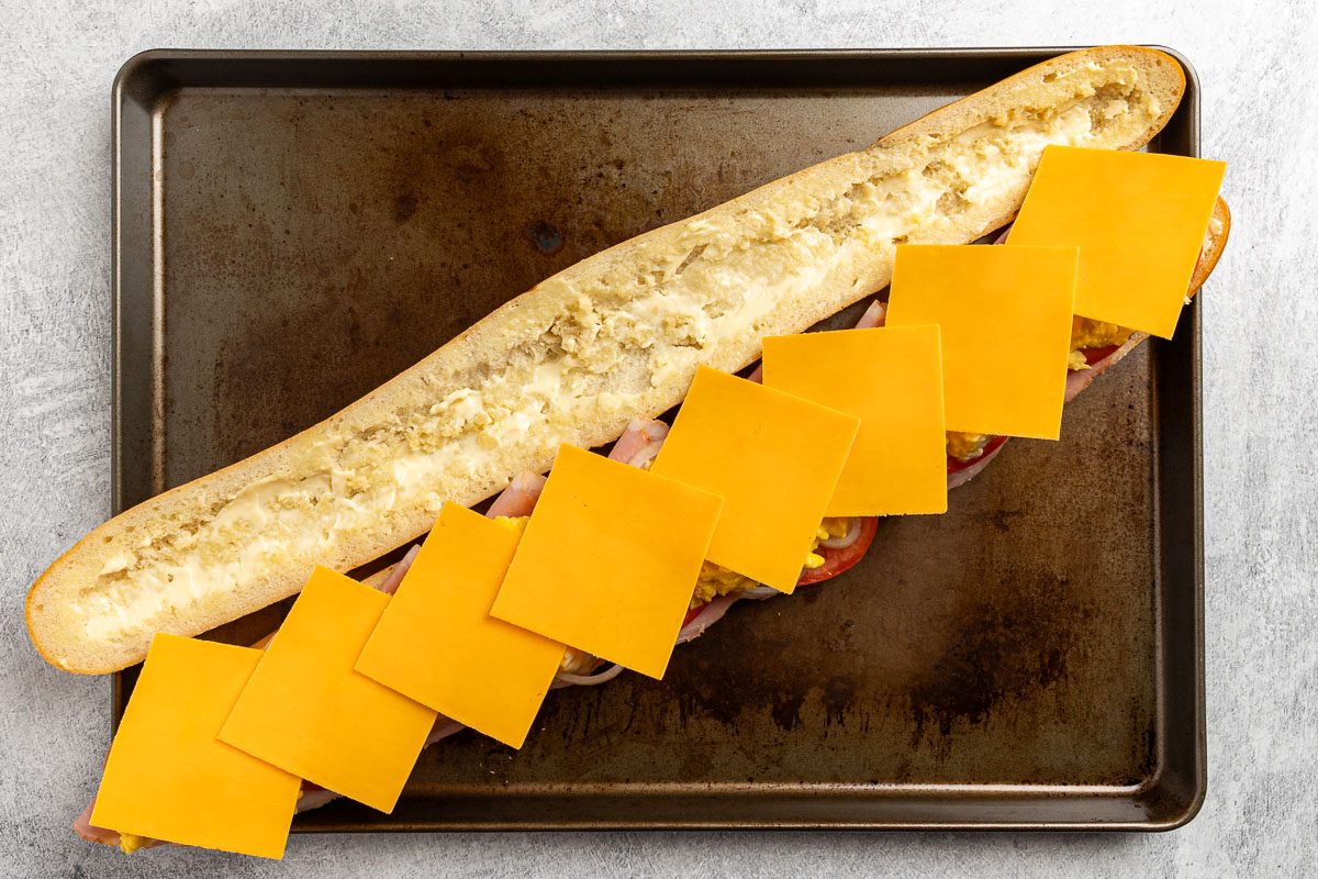 Taste of Home Ham Egg and Cheese Sandwich recipe photo of adding the remaining ingredients to the bread and baking.