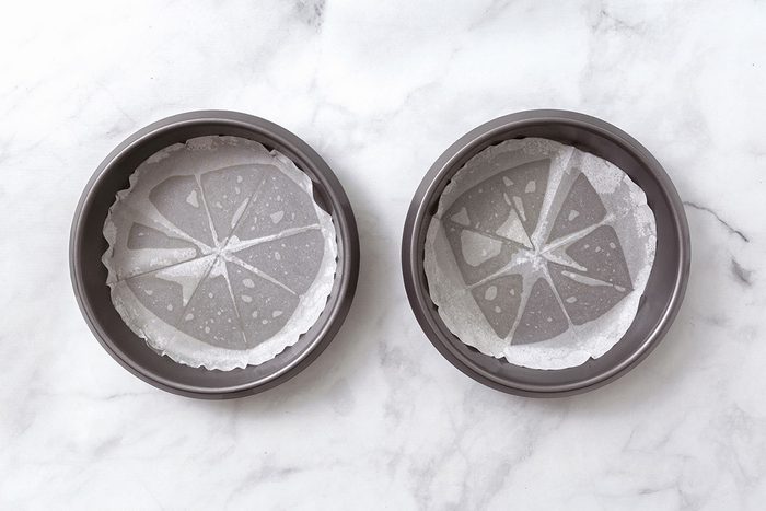 Step 1 Of Greased Round Baking Pans For Lemon Cake Recipe For Taste Of Home