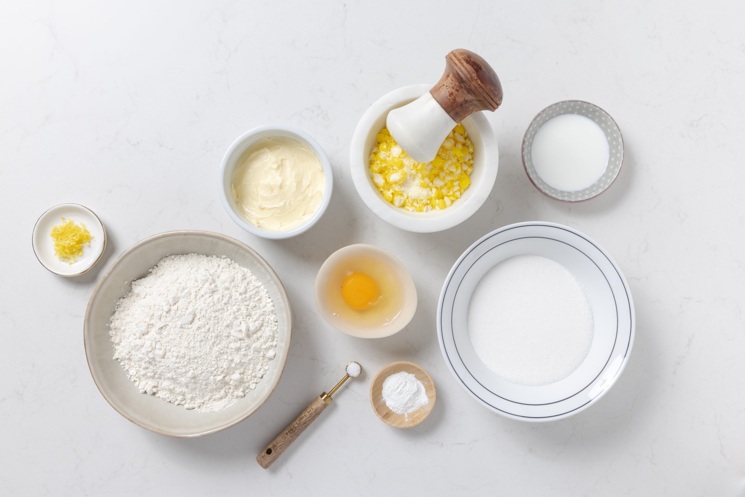 Ingredients for lemon drop cookies on kitchen counter.