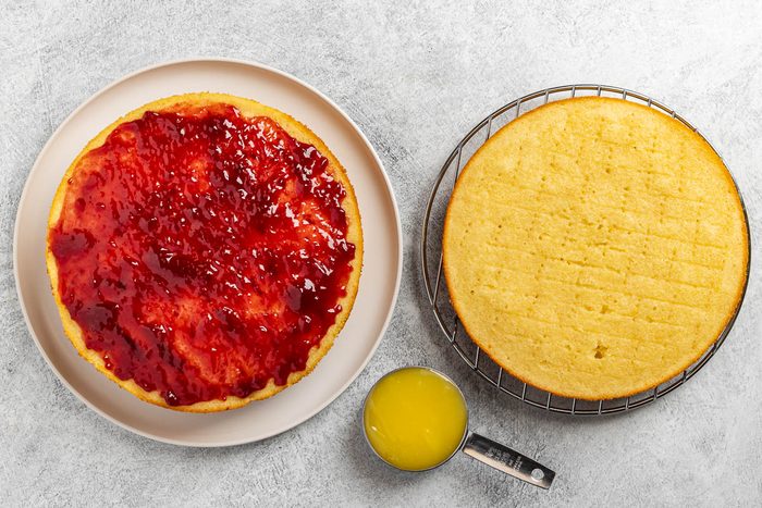 Taste of Home Lemon Raspberry Cake recipe photo assembling the cake.