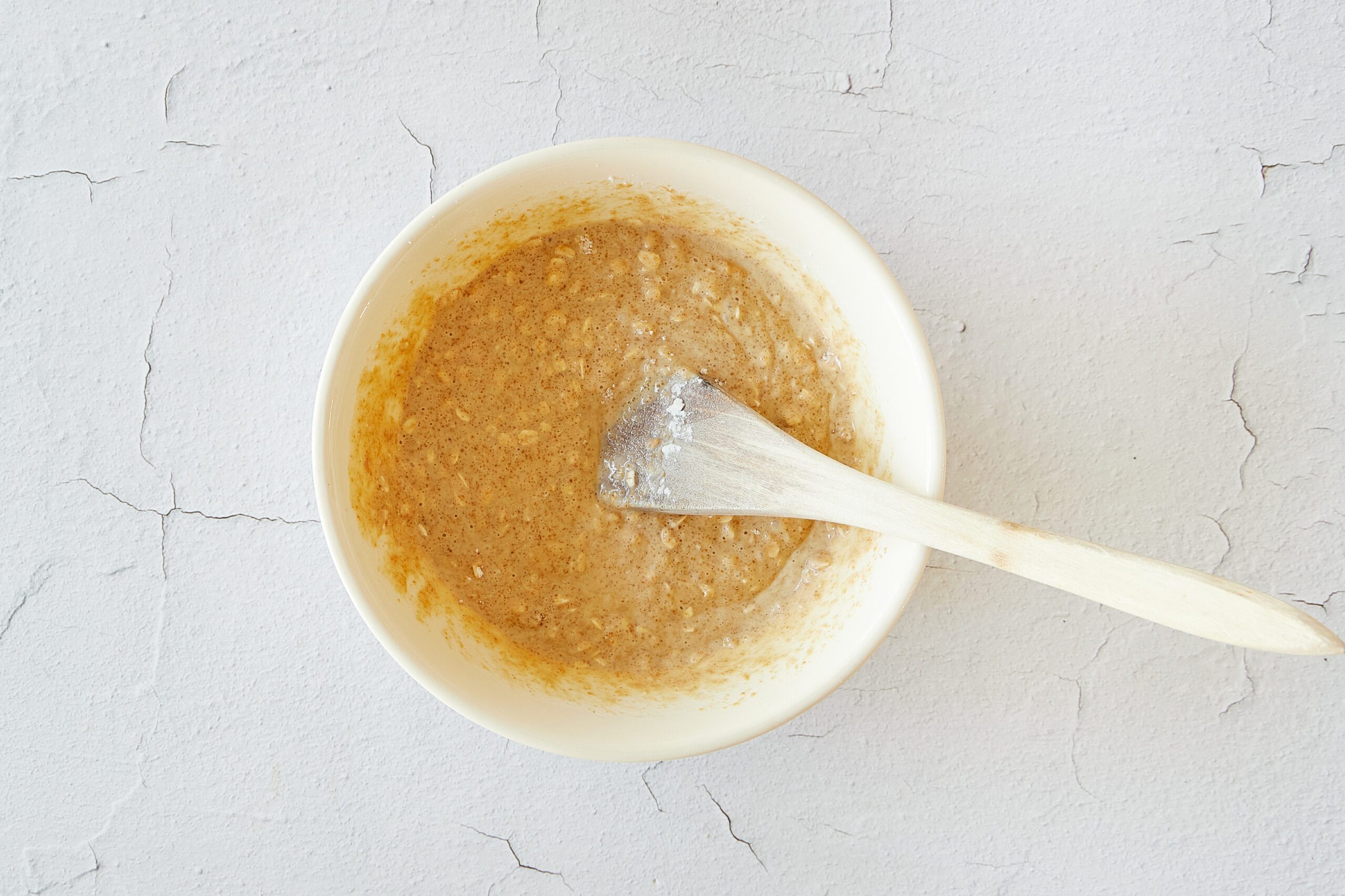 Mix the wet and dry ingredients for peanut butter muffins