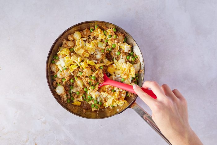 Mix the eggs into the veggies for teriyaki steak.