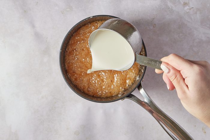 Make the caramel sauce for the praline ice cream.