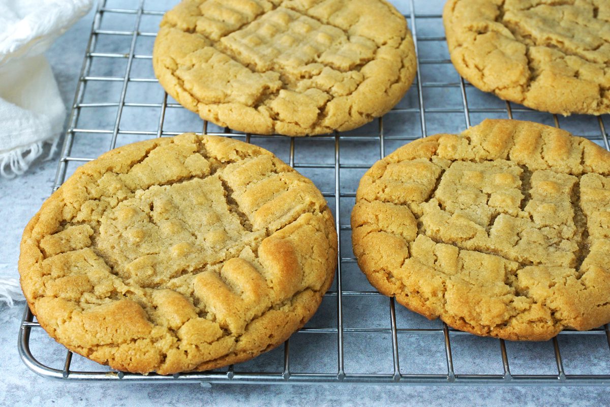 A cooling rack with freshly baked Taste of Home Peanut Butter Cookies RMS 7873