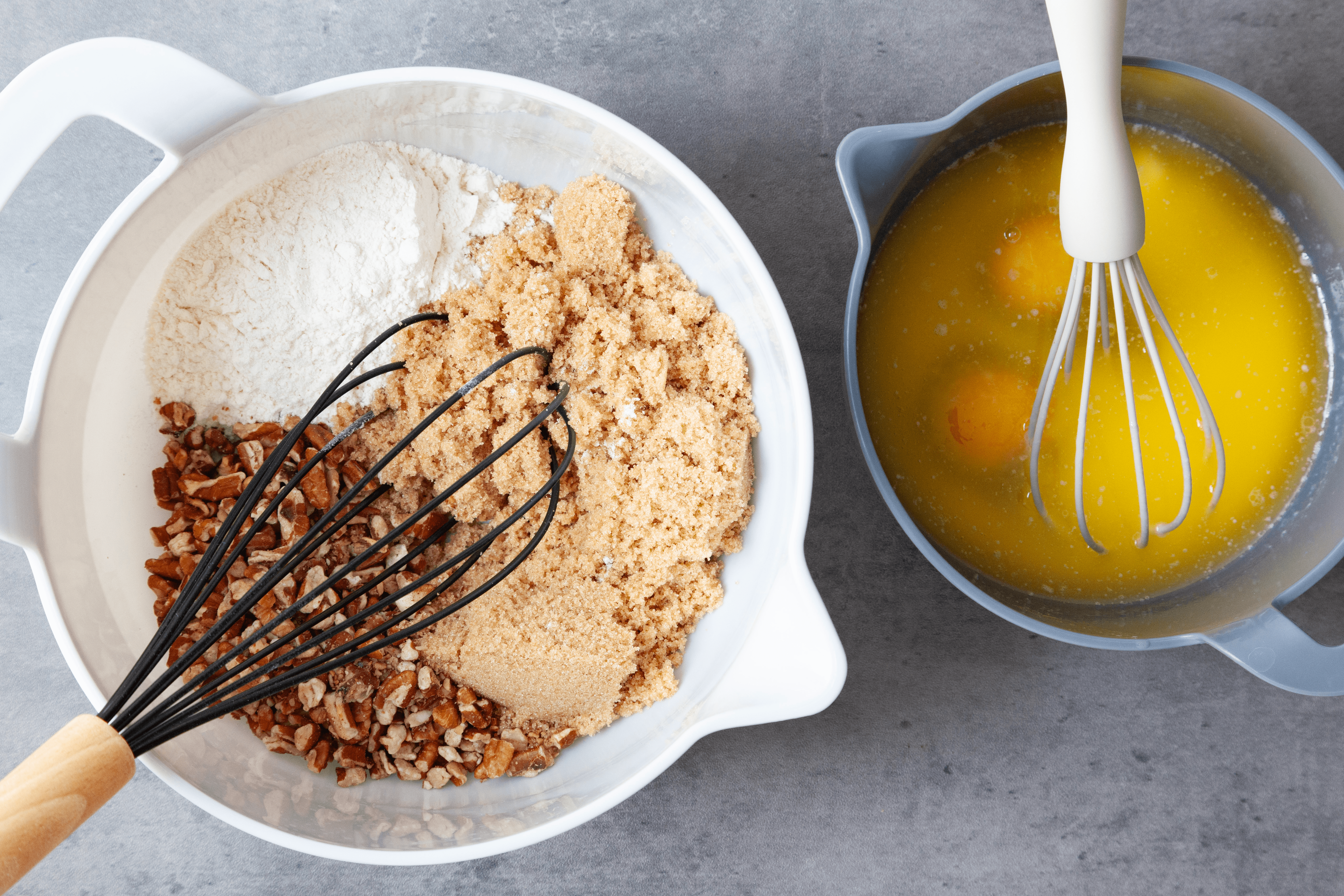Step 1 of Taste of Home Pecan Pie Muffins is to combine the brown sugar, flour and pecans. In another bowl, mix the melted butter and eggs. Then mix the wet ingredients into the dry ones.
