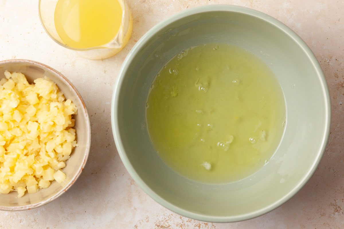 Step 1 of Taste of Home Pineapple Coconut Cake is to let egg whites sit in a bowl for 30 minutes. Separate pineapple from juice and reserve.