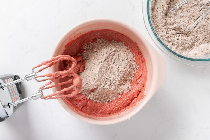 Dry ingredients being incorporated to wet ingredients mixture.