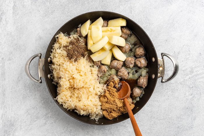 Taste of Home Sauerkraut Casserole recipe photo of the remaining ingredients added to the skillet.