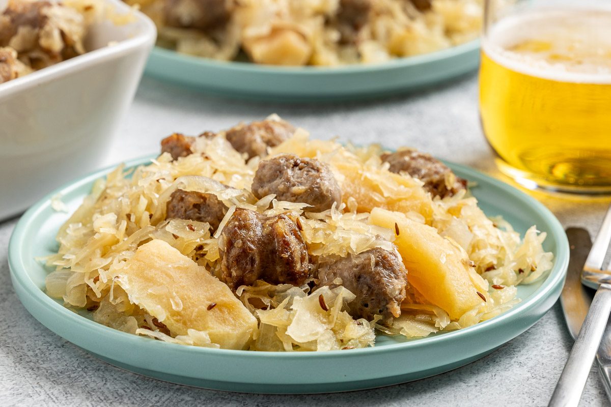 Taste of Home Sauerkraut Casserole recipe photo of the finished recipe served on plates.