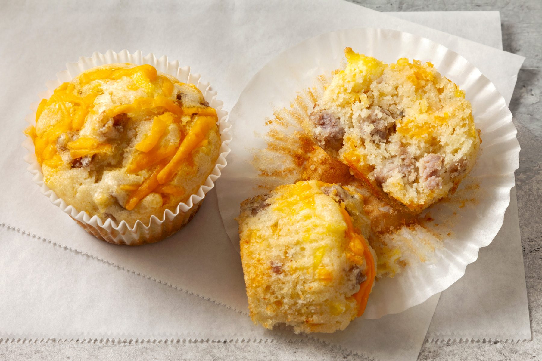 Sausage Muffins kept on baking paper broken in half