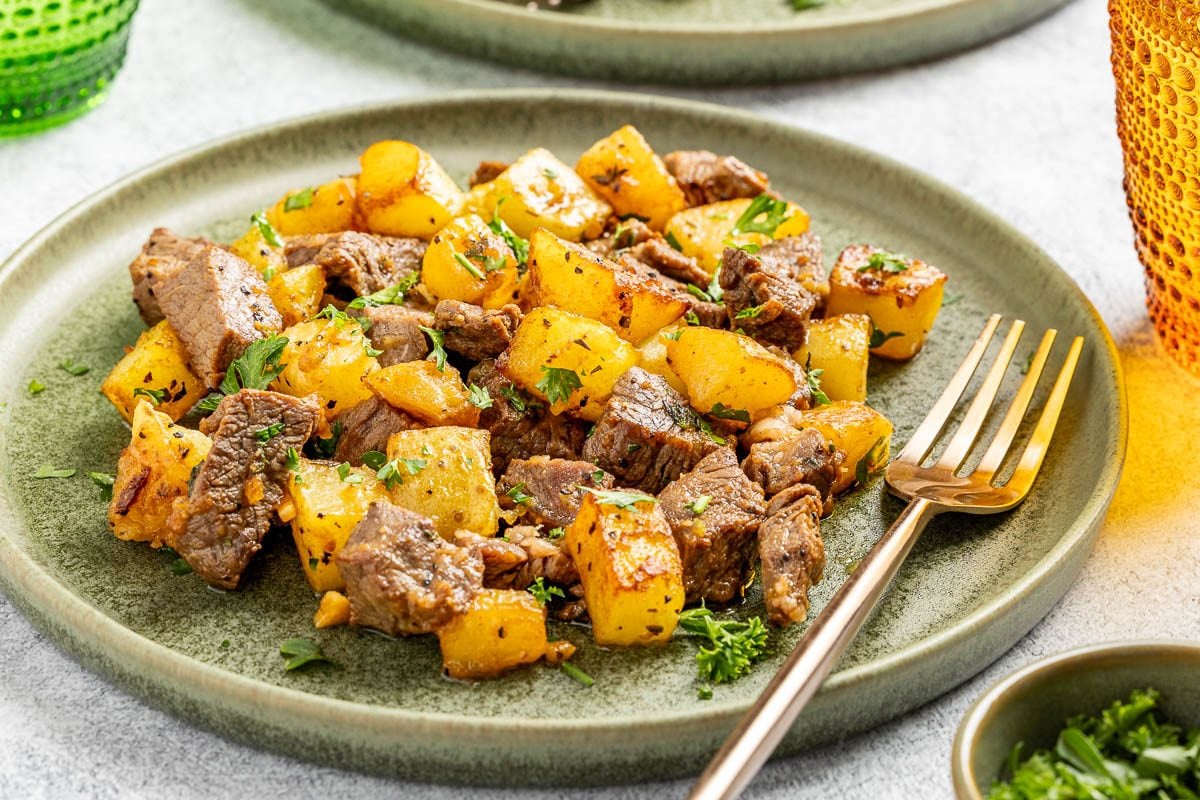 Taste of Home Steak and Potatoes recipe photo of the finished recipe served on plates.