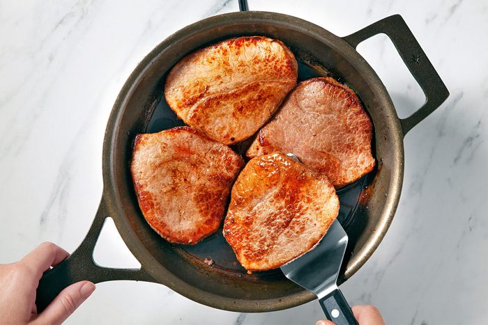 Trim beef and cook Brown on both sides in drippings;