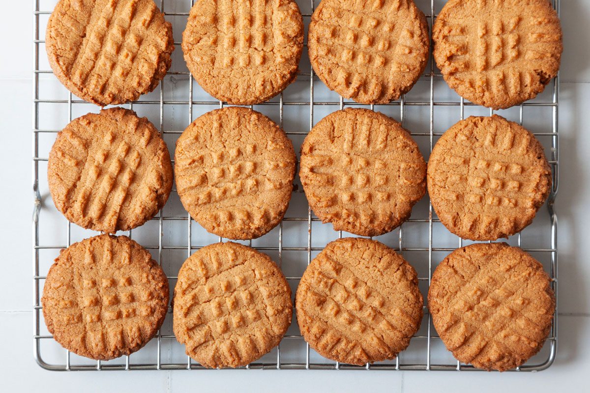 Step 2 of Taste of Home 3-Ingredient Peanut Butter Cookies is to bake the cookies for 18 minutes and then cool on wire racks