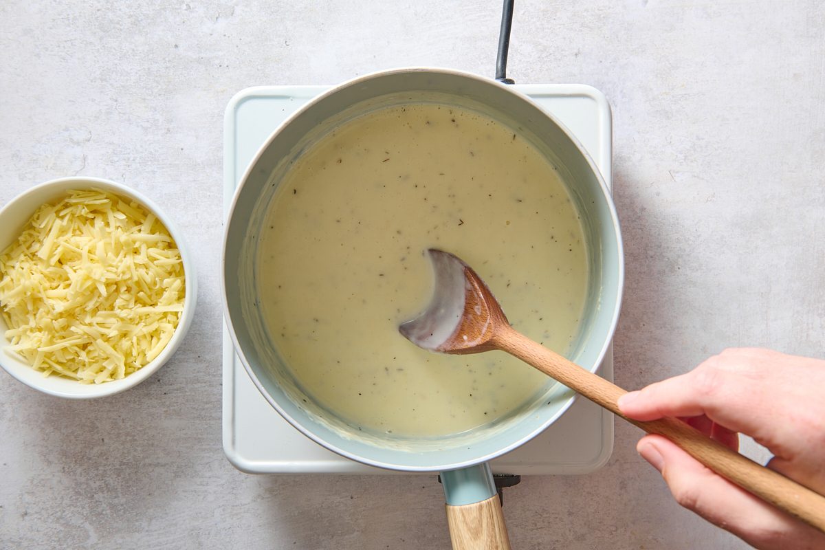 Making the cheese sauce in a saucepan