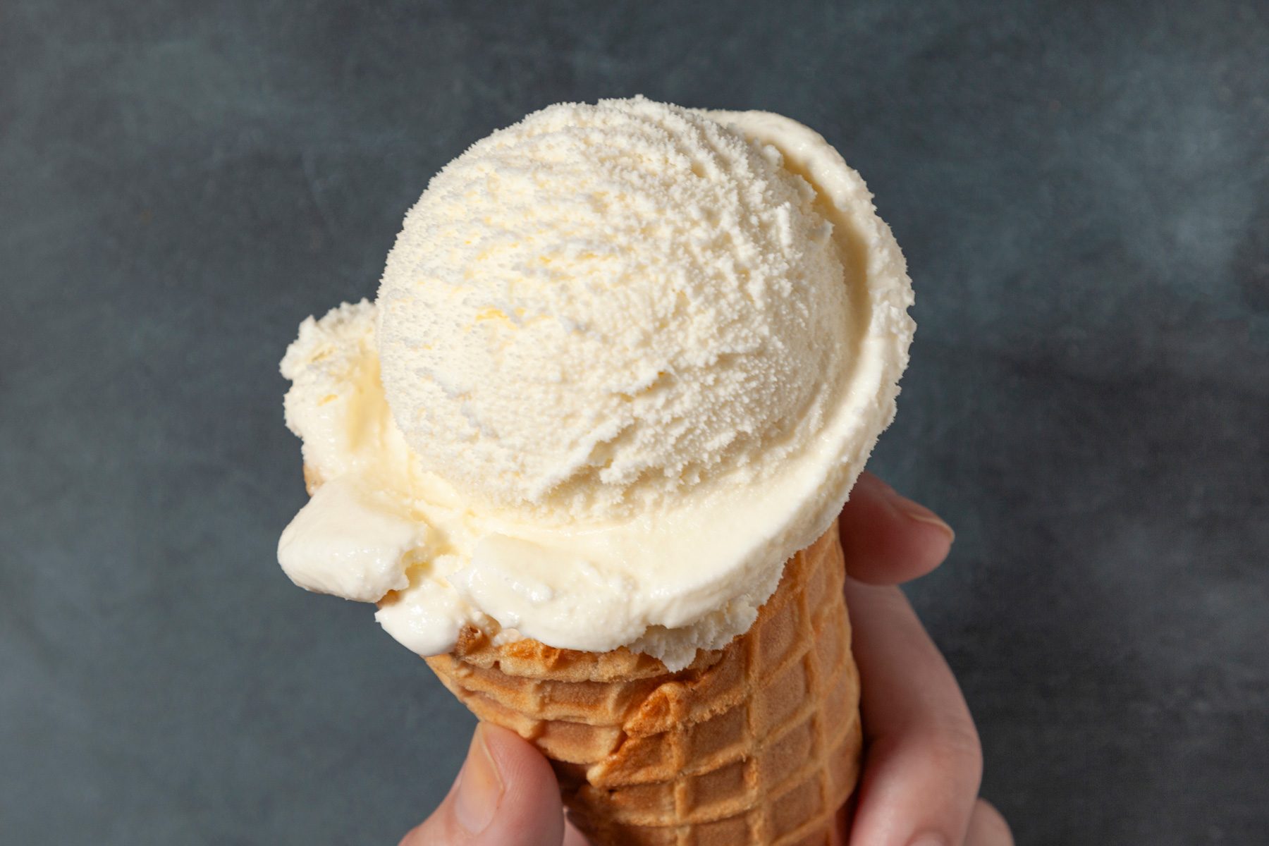 Vanilla Ice Cream in waffle cone close up
