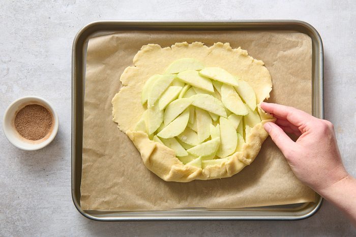 Folding the dough over the apple filling