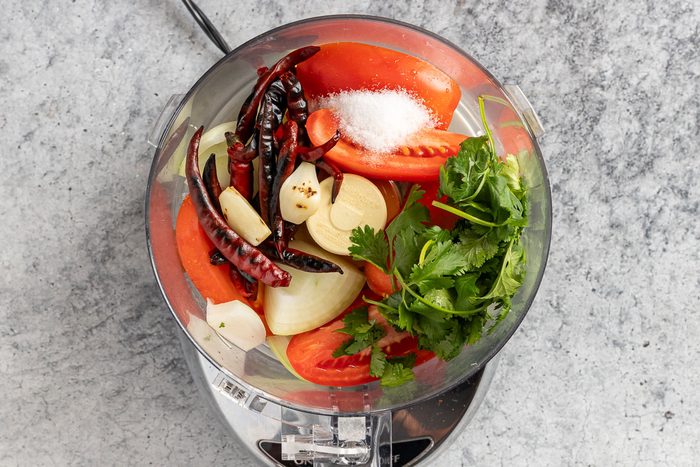 Taste of Home Arbol Chile Salsa photo of all the ingredients in a food processor.