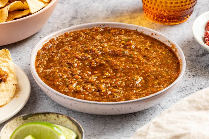 Taste of Home Arbol Chile Salsa photo of the finished recipe in a serving bowl with tortilla chips.