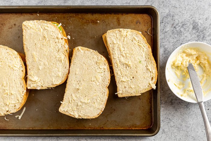 Taste of Home Avocado Grilled Cheese recipe photo of applying the spread to the outside of the bread.