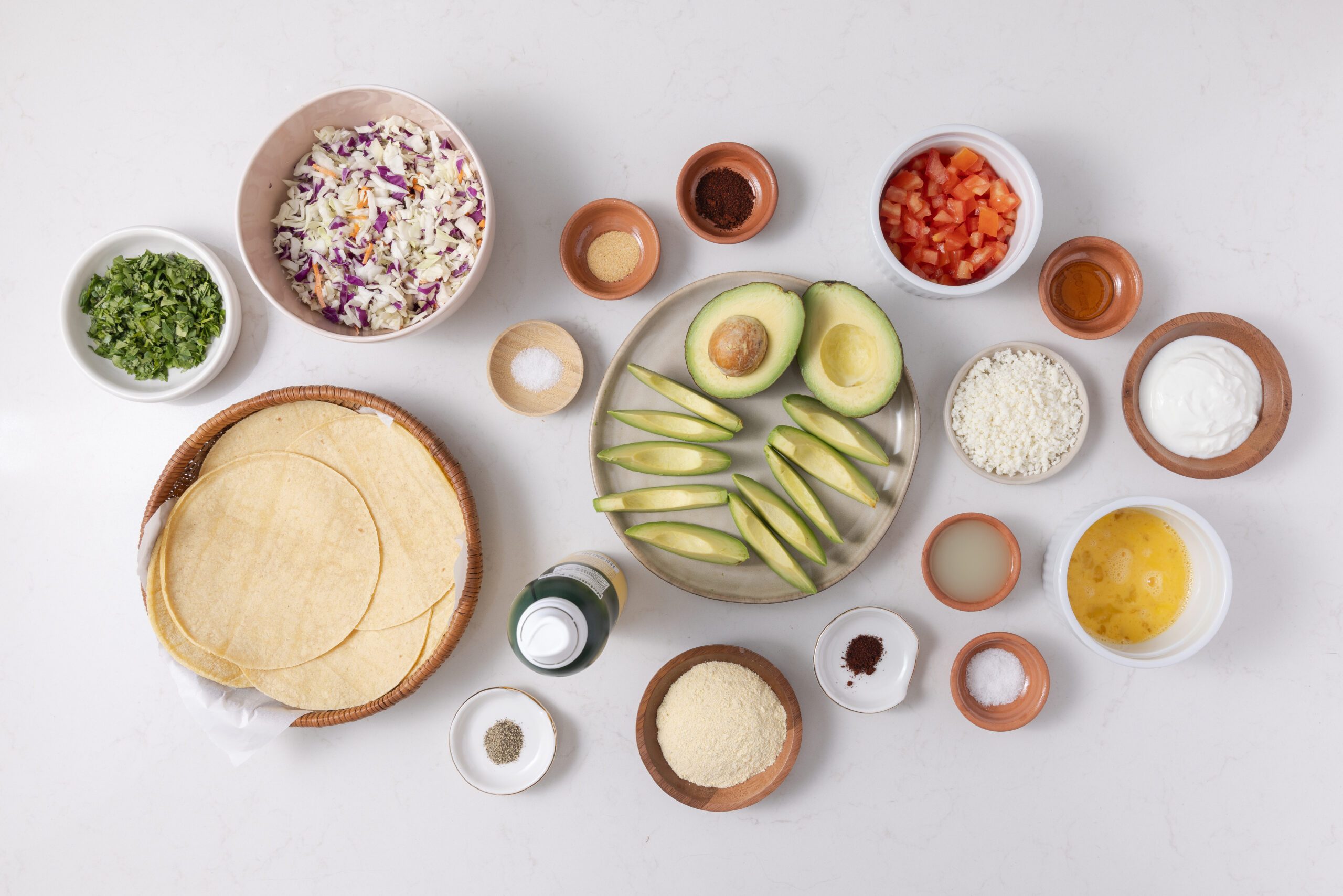 Ingredients for avocado tacos on kitchen counter.