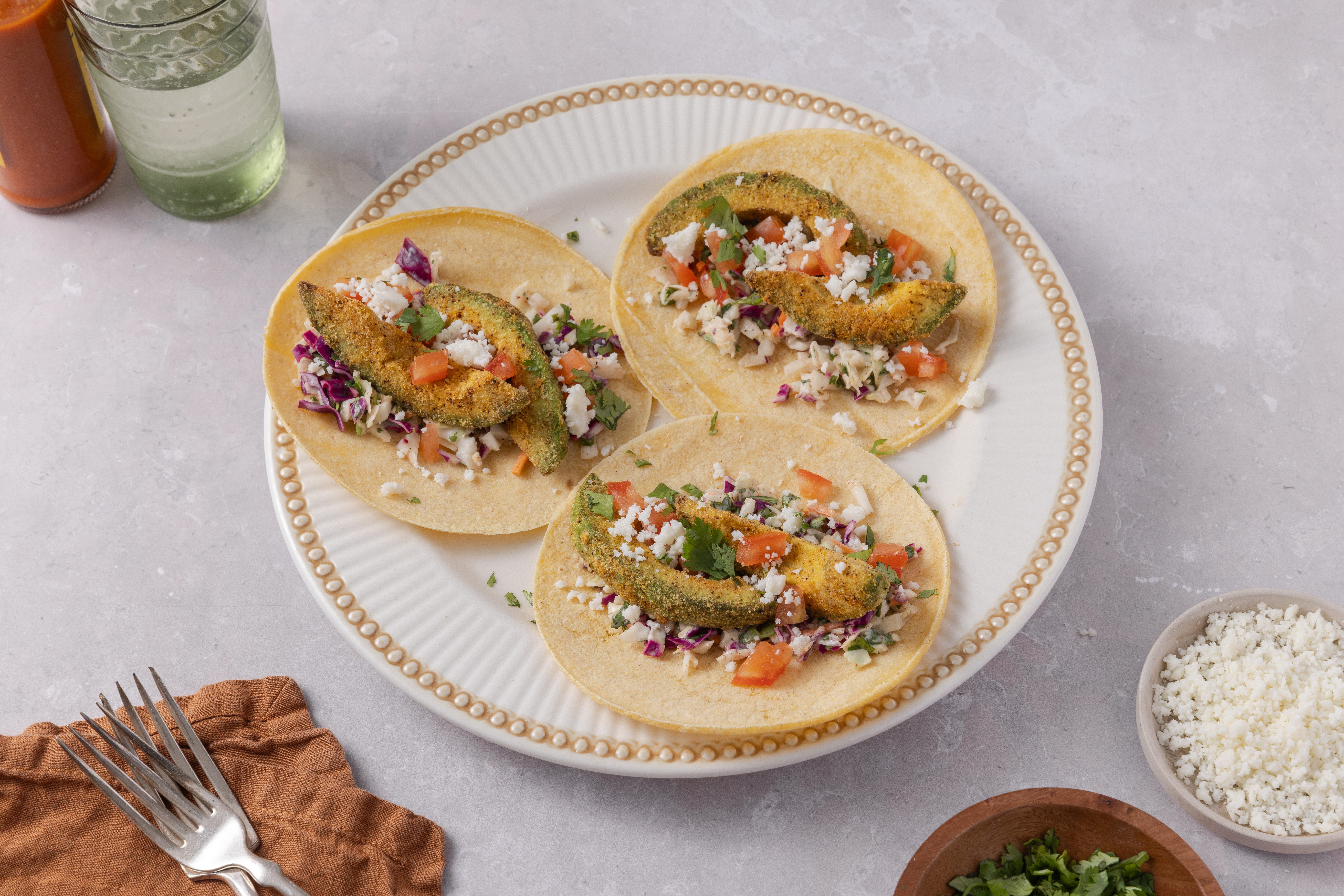 Avocado tacos ready and served on plate.
