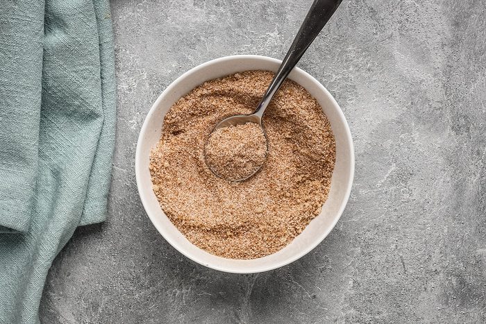 A bowl of cinnamon sugar with granulated and brown sugar, for banana beignets.