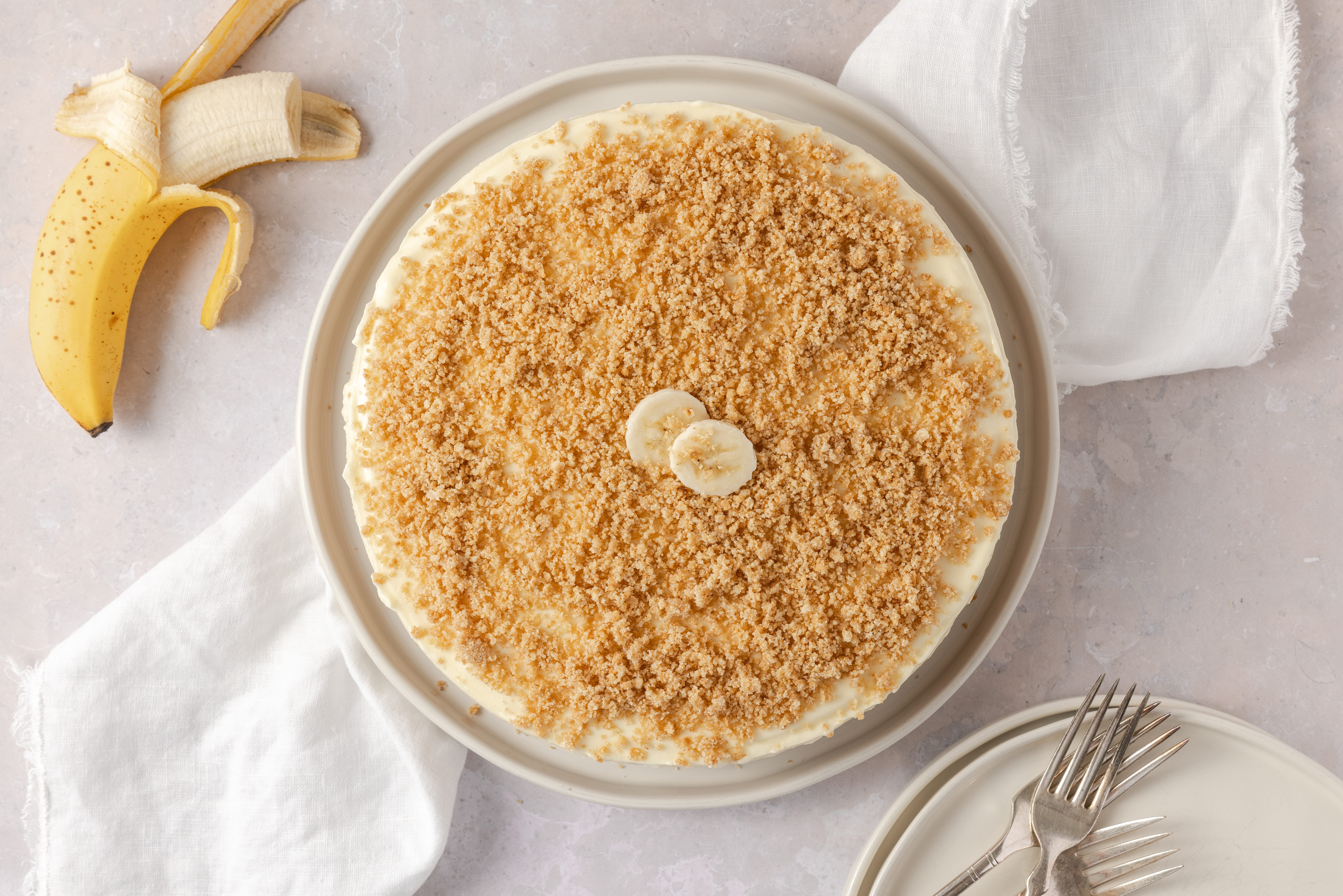 Banana cream cheesecake ready served on plate.