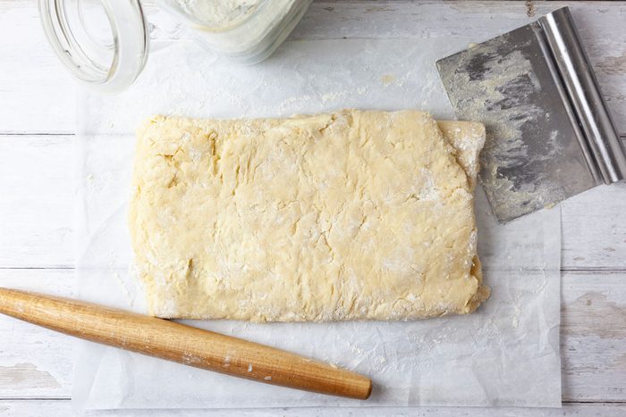 Step 3 of Taste of Home Bear Claw is to roll into a 21x12-inch rectangle. Starting at a short side, fold the dough in thirds, forming a 12x7-inch rectangle. Give the dough a quarter turn; roll into a 21x12-inch rectangle. Fold into thirds, starting with a short side. Repeat, flouring the surface as needed. Cover and chill until firm for anywhere from 4 to 24 hours.