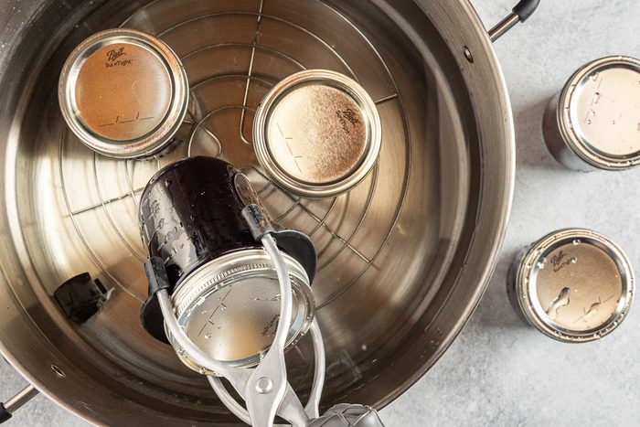Taste of Home Blueberry Jelly Recipe photo of processing the jars in a water bath.