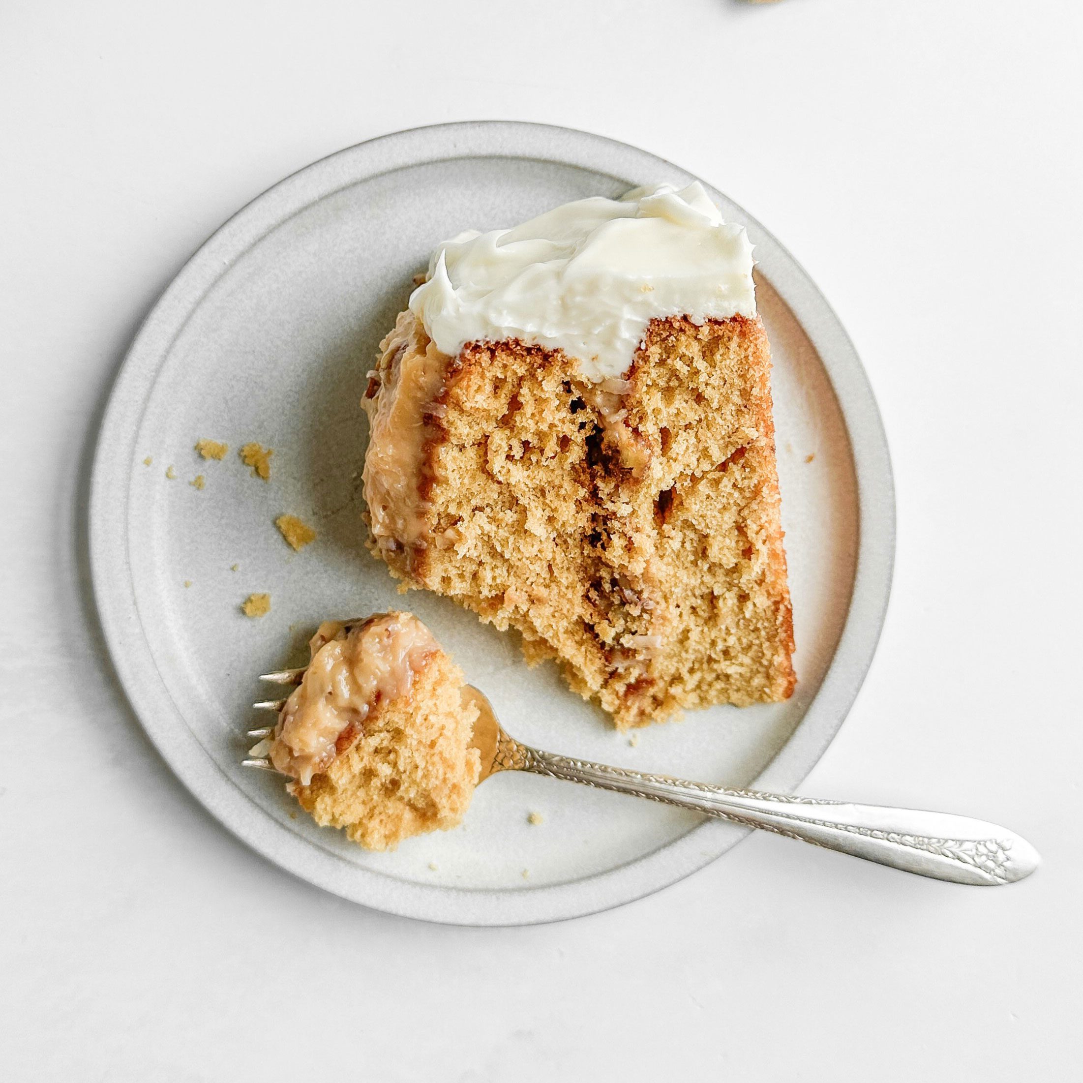 Taste of Home Butterscotch Cake on a white plate with a vintage fork