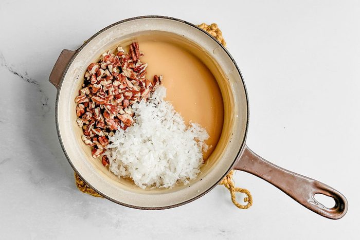 Filling ingredients for Taste of Home Butterscotch Cake in a ceramic saucepan