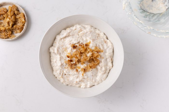 Caramelized onion dip ready and garnished.