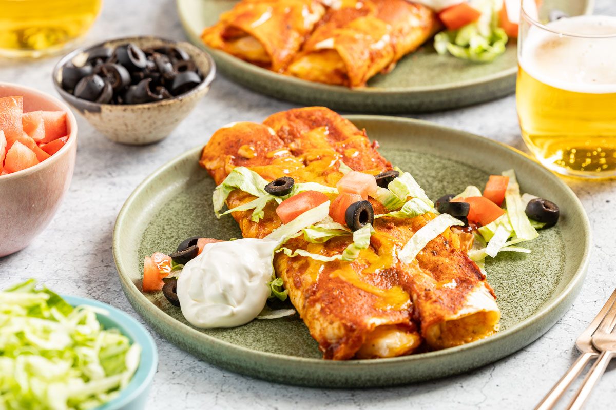 Taste of Home Cheese Enchiladas recipe photo of the finished recipe served on plates.