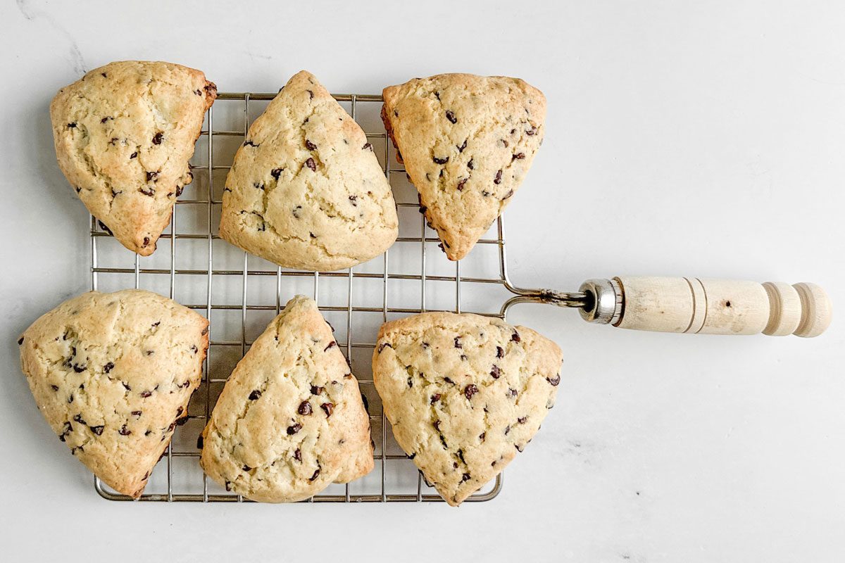 Taste of Home Chocolate Chip Scones on a wire rack on a marble surface