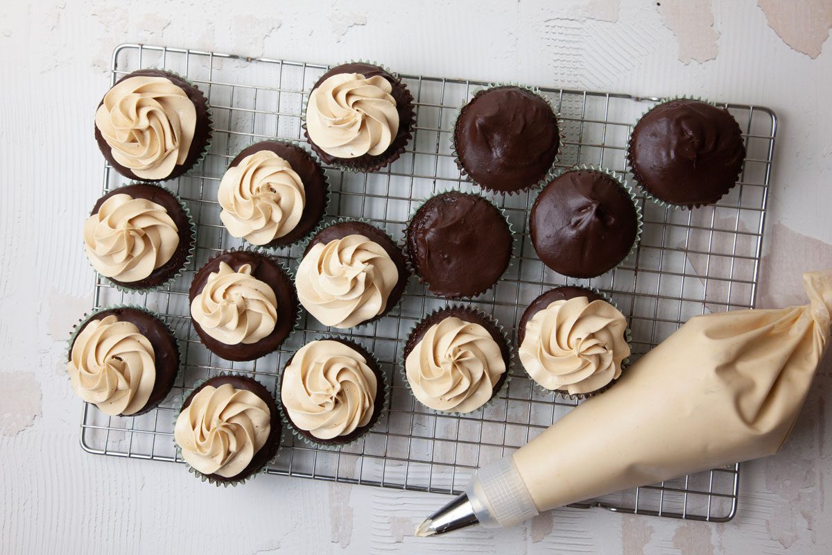 Step 7 of Taste of Home Chocolate Peanut Butter Cupcakes is to place the frosting in a pastry bag with a large star tip, then pipe it onto each cupcake