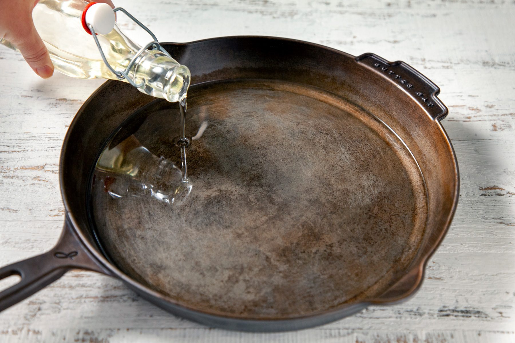 3/4th shot of oil poured into skillet