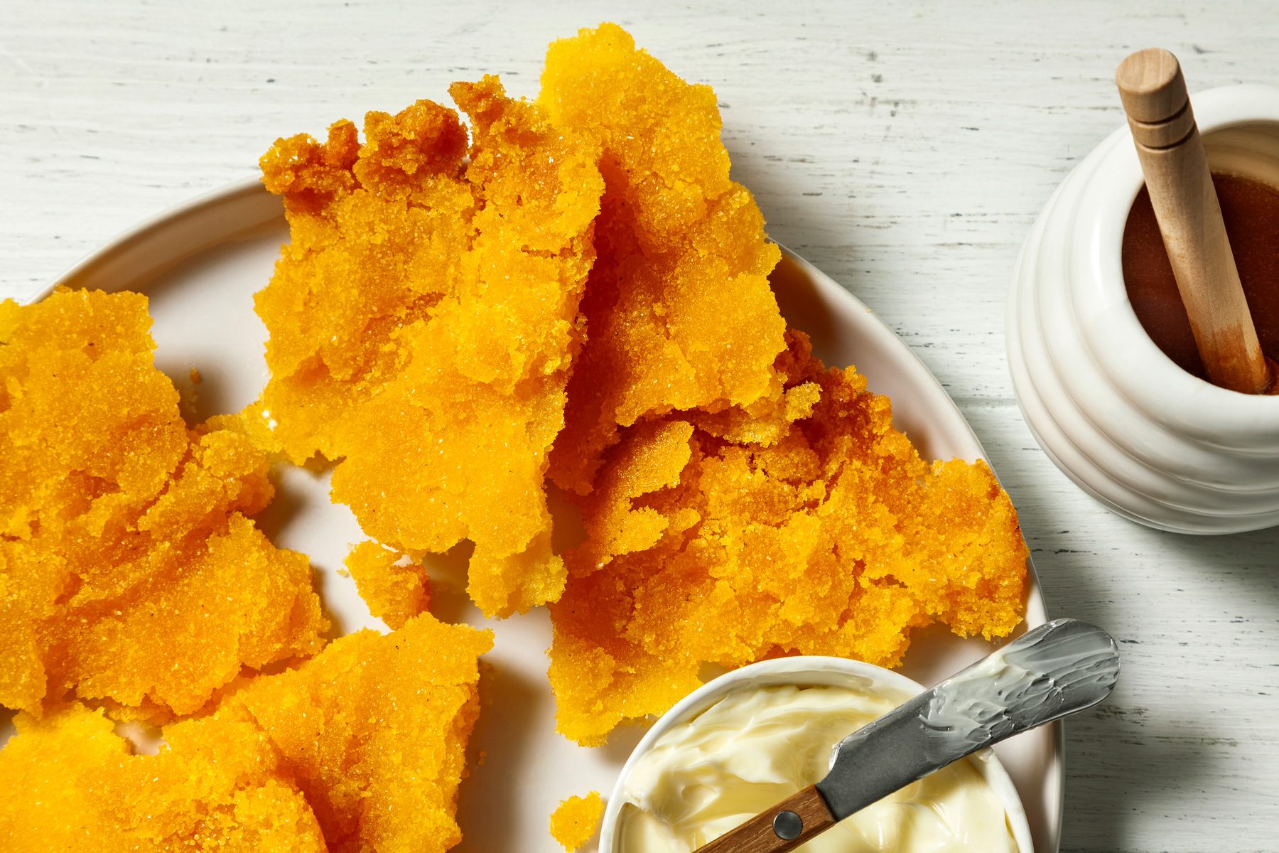 3/4th shot of corn pone served with butter and honey