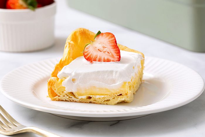 Slice Of Cream Puff Cake On Plate For Taste Of Home