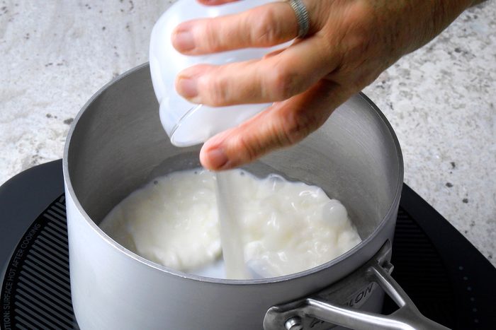 Scald milk in a saucepan; add butter, sugar and salt.