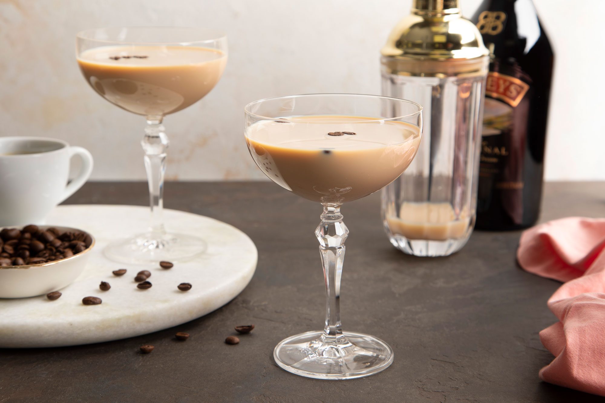 Espresso Martini With Baileys served in martini glasses with coffee beans on top
