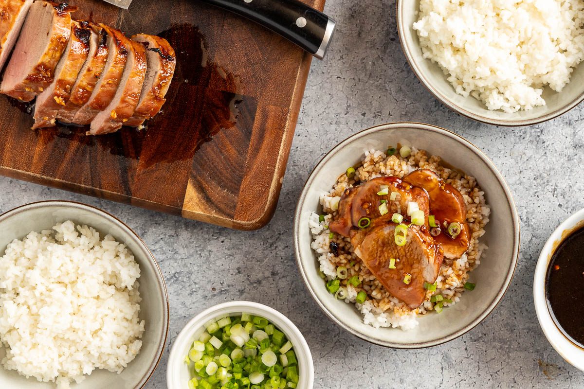 Taste of Home Hoisin Pork Tenderloin photo of slicing and serving the tenderloin.