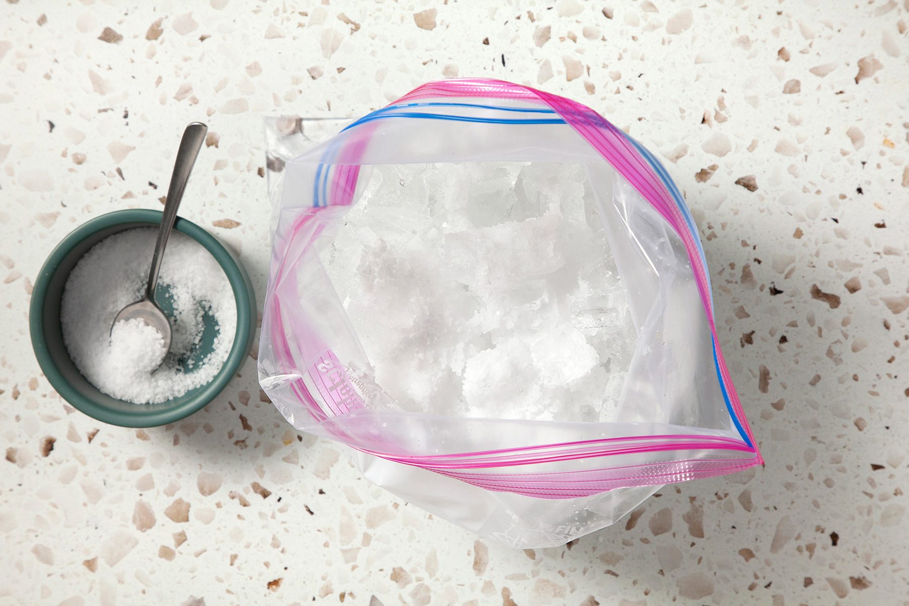 In a large resealable plastic bag, combine the ice and salt;