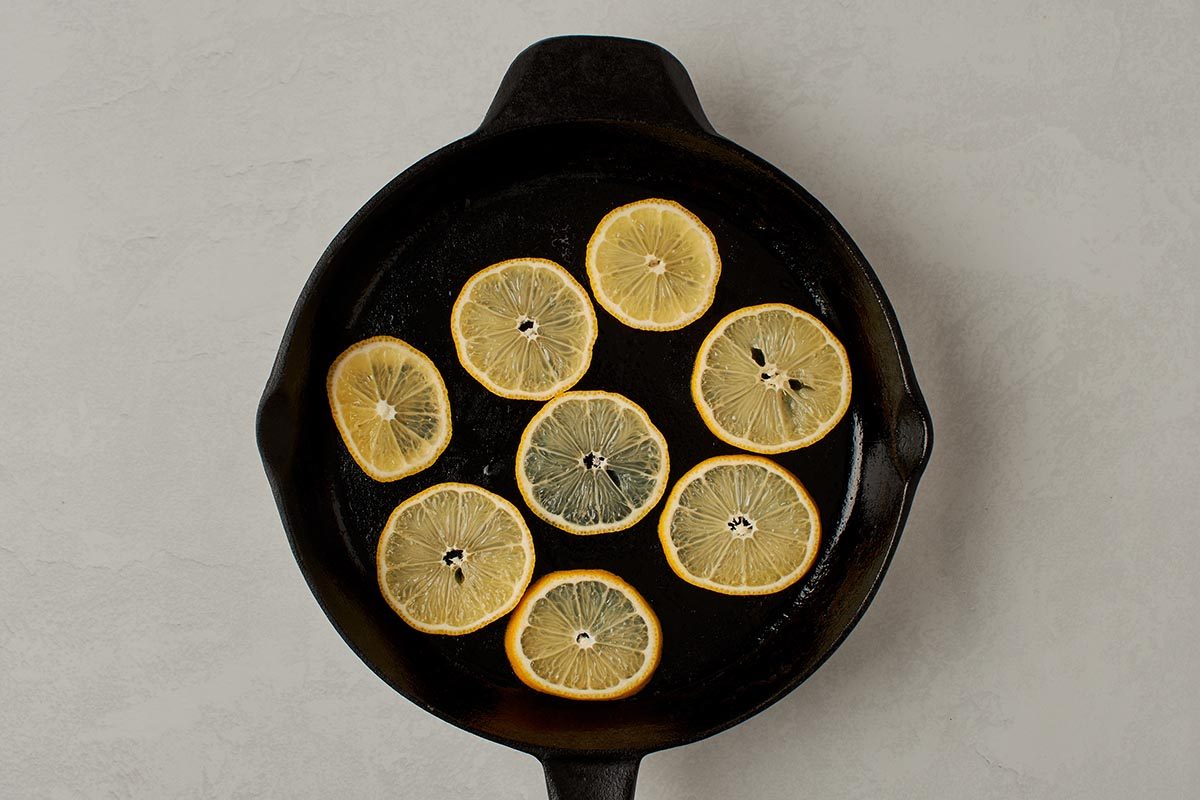 Lay lemon slices in skillet