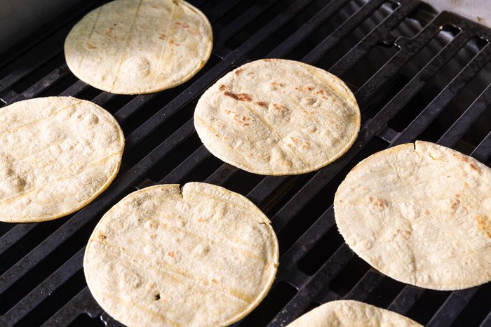 Corn tortillas on the grill.