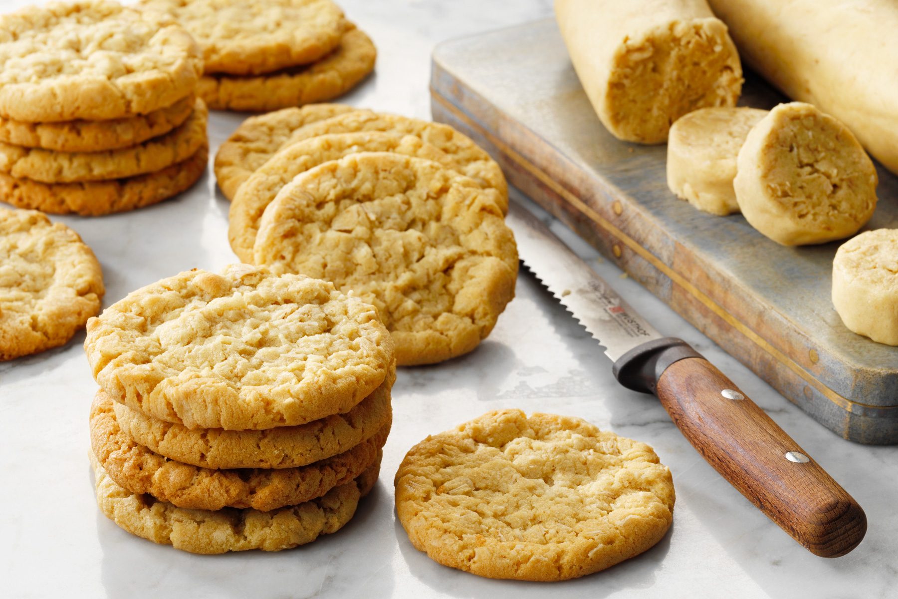 Oatmeal Coconut Cookies stacked with dough on side