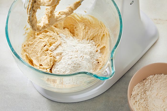Top view shot of adding flour and other ingredients in the mixture